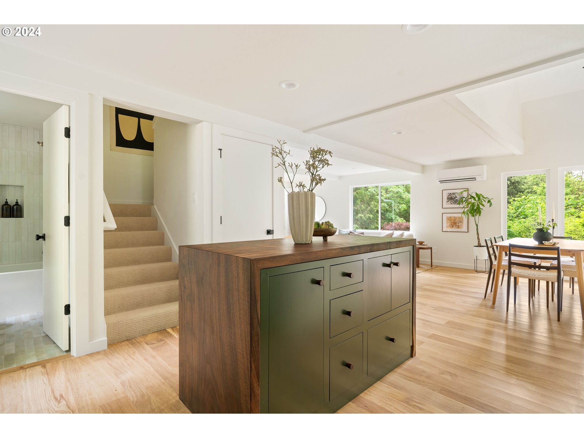 2162 Duncan Creek Road Stevenson, WA 98648 - Photo 17 of 38 a kitchen with wooden floors and white cabinets