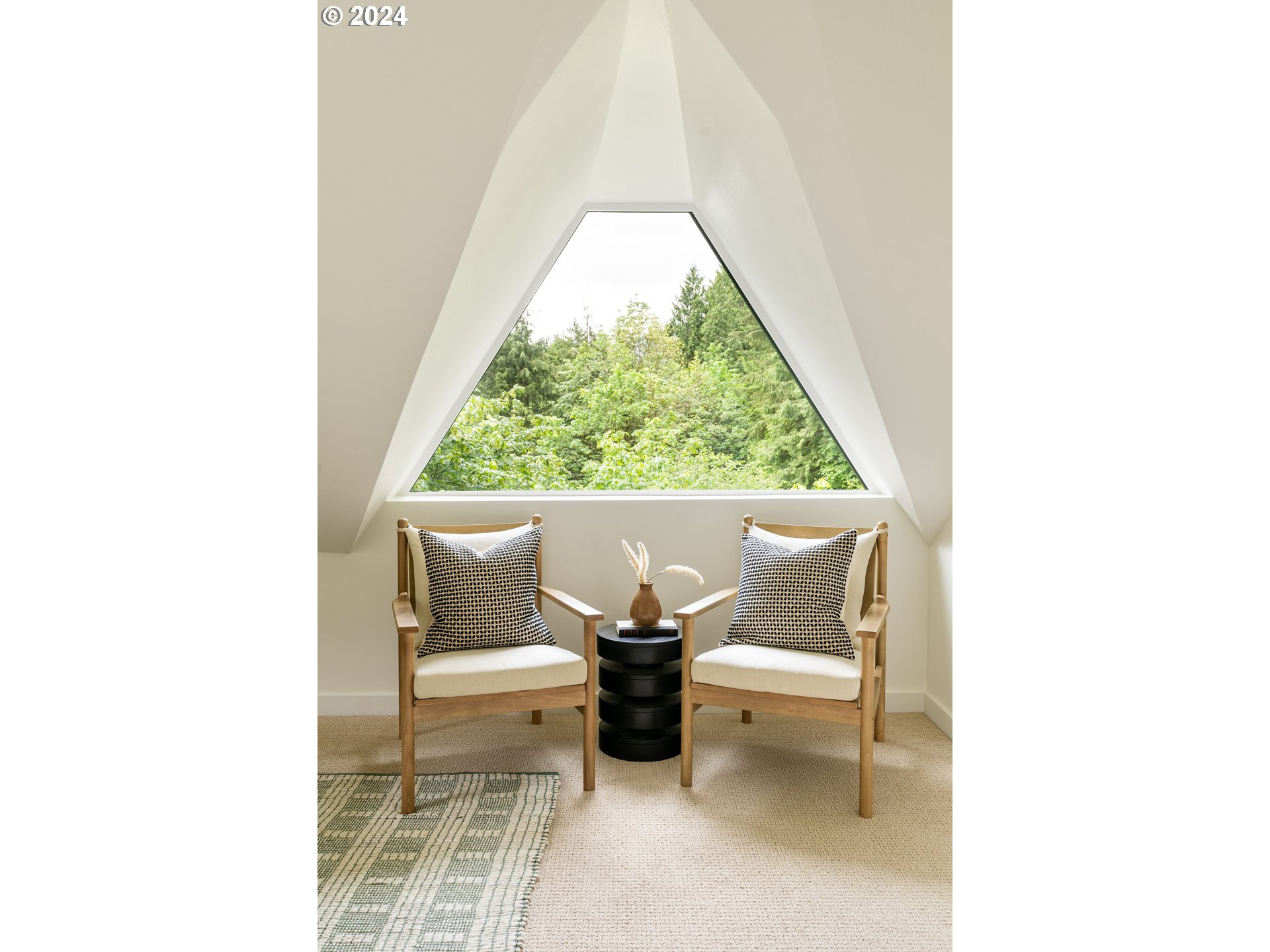 2162 Duncan Creek Road Stevenson, WA 98648 - Photo 22 of 38 a view of a living room with a chair and a potted plant