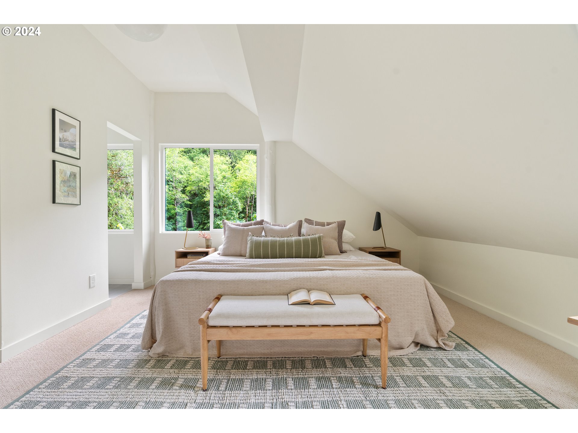 2162 Duncan Creek Road Stevenson, WA 98648 - Photo 24 of 38 a bed sitting in a bedroom next to a window