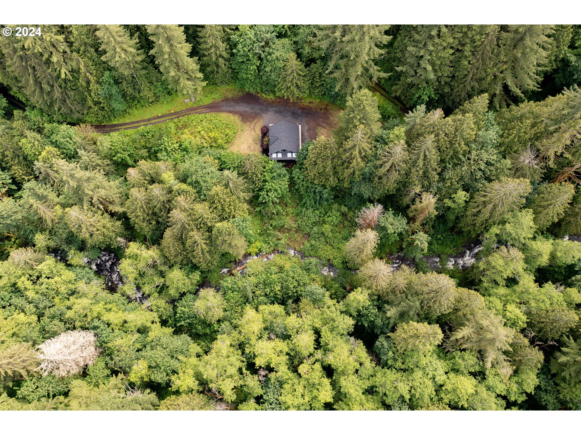 2162 Duncan Creek Road Stevenson, WA 98648 - Photo 29 of 38 an aerial view of a house with a yard