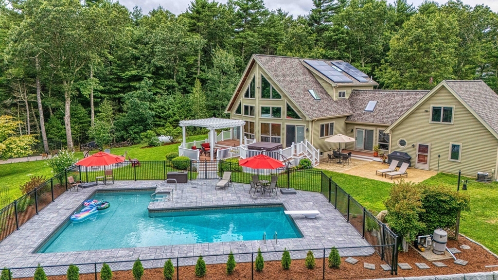 78 Howland Road Assonet, MA 02702 - Photo 1 of 41 an aerial view of a house with swimming pool and patio