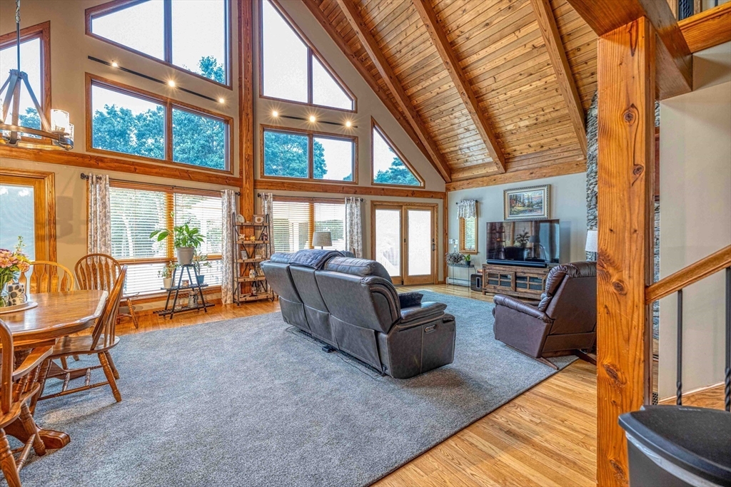 78 Howland Road Assonet, MA 02702 - Photo 15 of 41 a living room with furniture and a floor to ceiling window