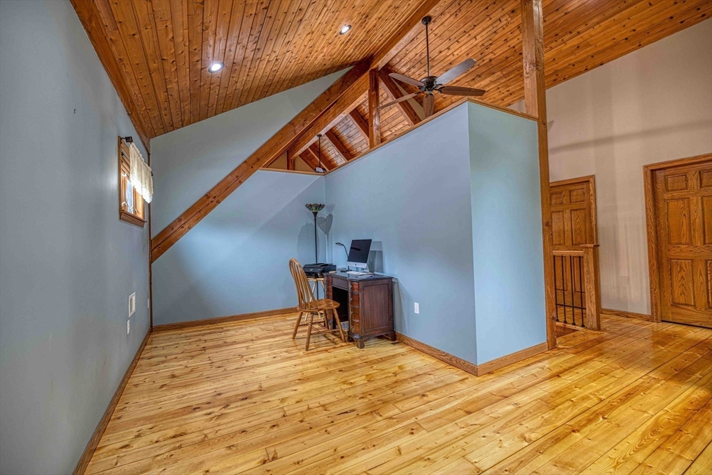 78 Howland Road Assonet, MA 02702 - Photo 18 of 41 a view of a livingroom with wooden floor and furniture
