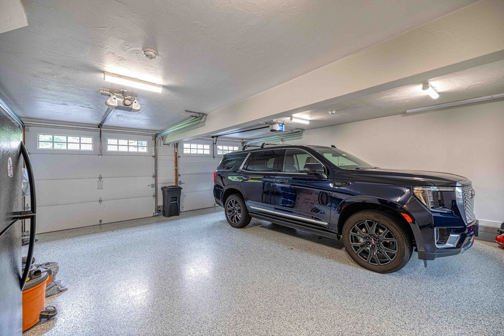 78 Howland Road Assonet, MA 02702 - Photo 28 of 41 a car parked in a garage