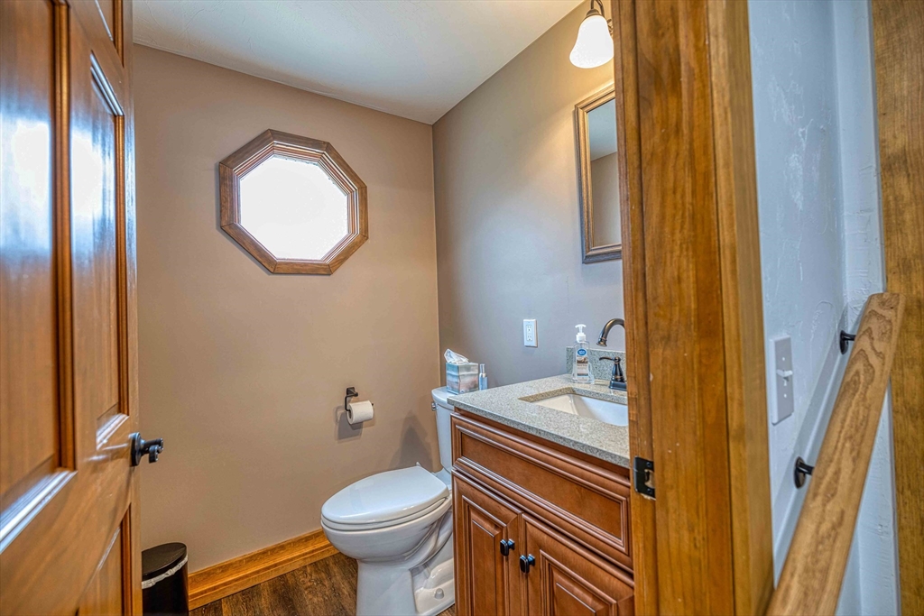 78 Howland Road Assonet, MA 02702 - Photo 30 of 41 a bathroom with a sink a toilet and a mirror