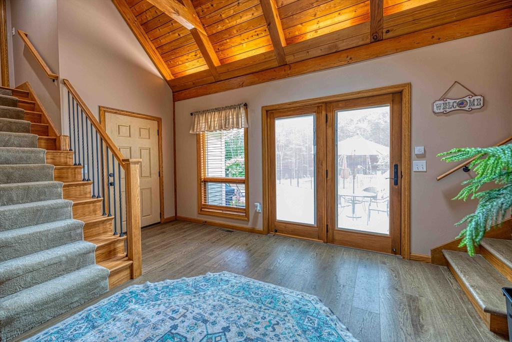 78 Howland Road Assonet, MA 02702 - Photo 3 of 41 a view of an entryway with wooden floor and door