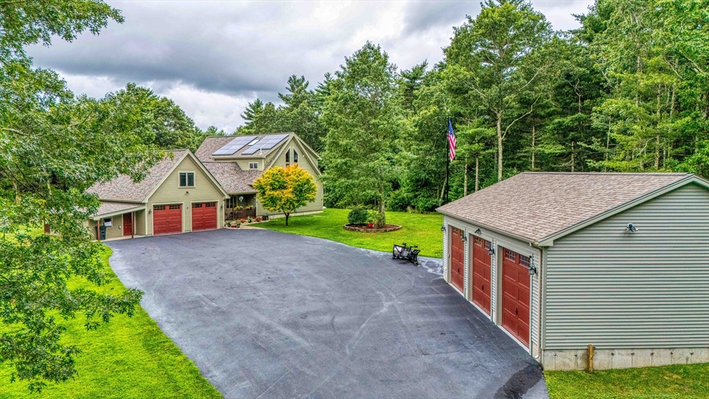 78 Howland Road Assonet, MA 02702 - Photo 36 of 41 a house with green field in front of it