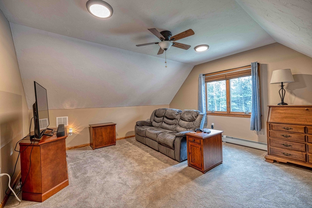 78 Howland Road Assonet, MA 02702 - Photo 5 of 41 a living room with furniture a ceiling fan and a window
