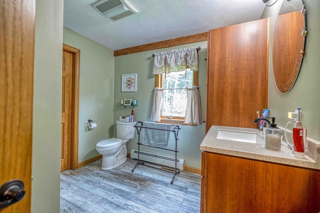 78 Howland Road Assonet, MA 02702 - Photo 10 of 41 a bathroom with a sink toilet and a mirror