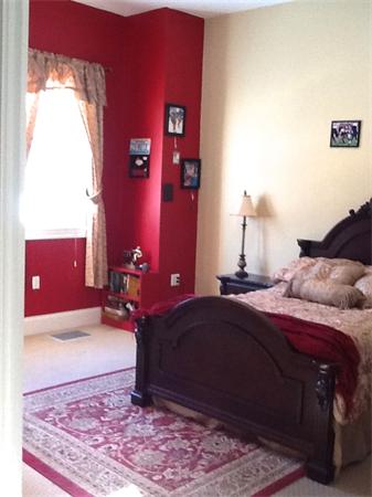 615 Mason Road Ashby, MA 01431 - Photo 14 of 22 a bedroom with a bed and a lamp next to a window