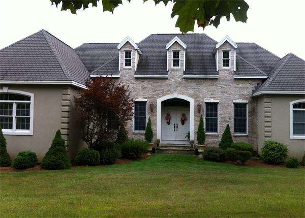 615 Mason Road Ashby, MA 01431 - Photo 2 of 22 a front view of a house with a garden