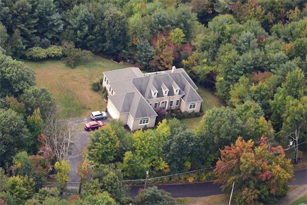 615 Mason Road Ashby, MA 01431 - Photo 4 of 22 an aerial view of a house around side of green forest