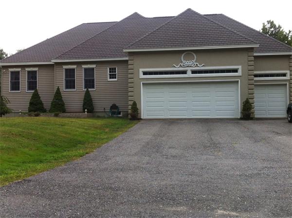 615 Mason Road Ashby, MA 01431 - Photo 5 of 22 a front view of a house with a yard and garage