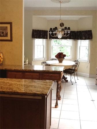 615 Mason Road Ashby, MA 01431 - Photo 10 of 22 a kitchen with a sink a counter and a dining table