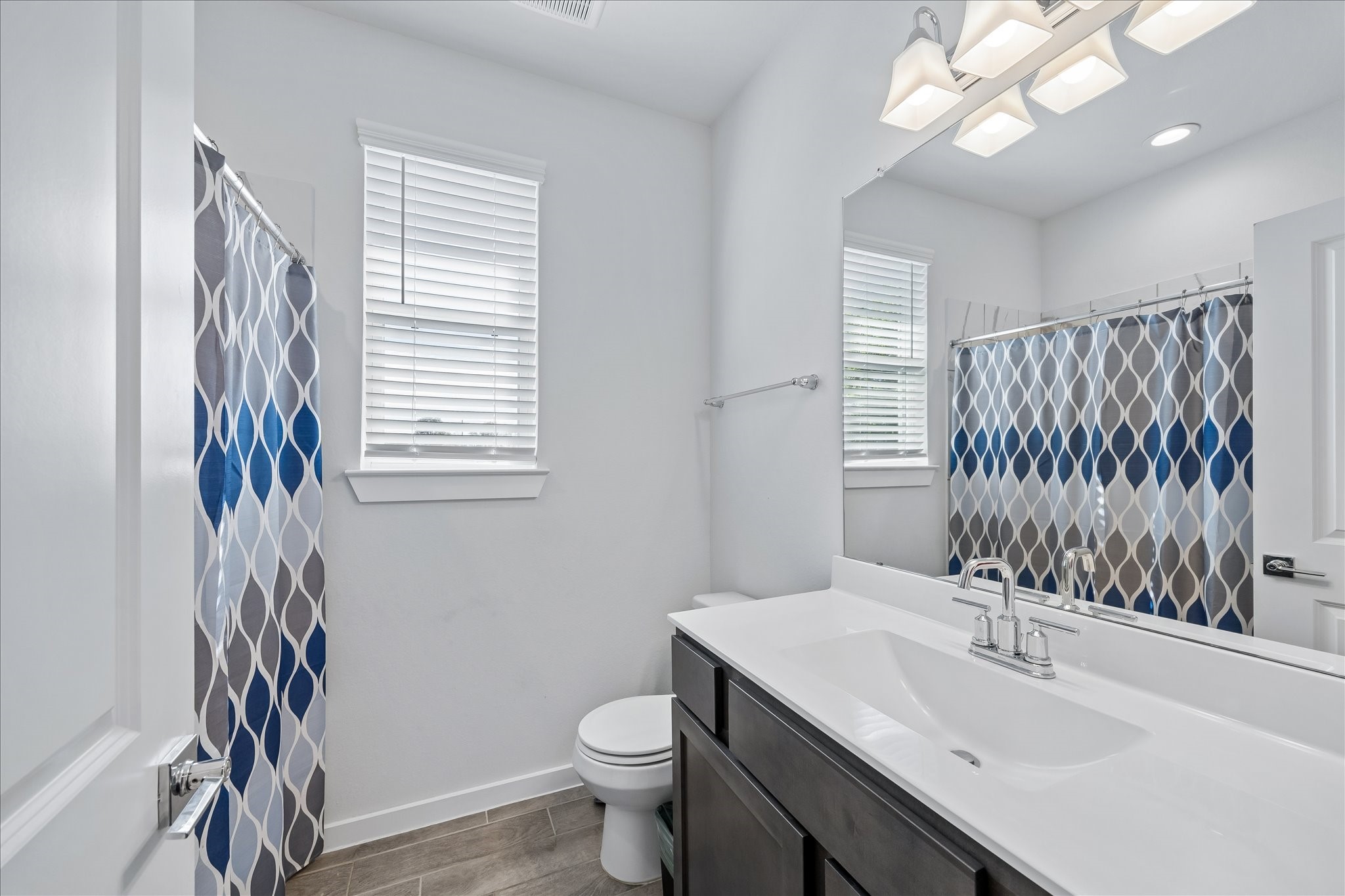33002 Carolyns Perfection Loop Fulshear, TX 77441 - Photo 23 of 29 a bathroom with a sink toilet and mirror