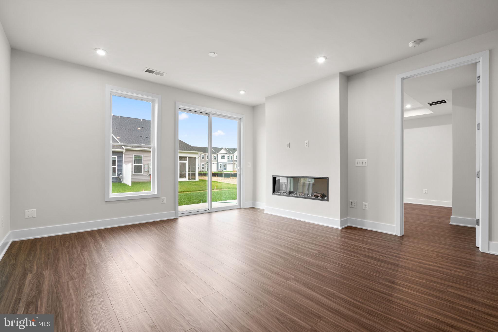 114 Keystone Winchester, VA 22603 - Photo 12 of 44 a view of an empty room with wooden floor and a window