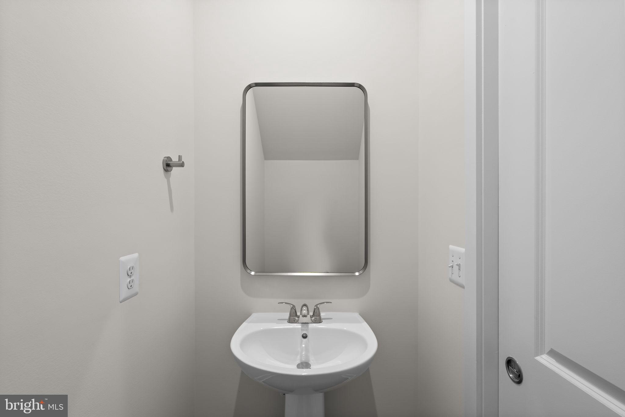 114 Keystone Winchester, VA 22603 - Photo 19 of 44 a bathroom with a sink and a mirror