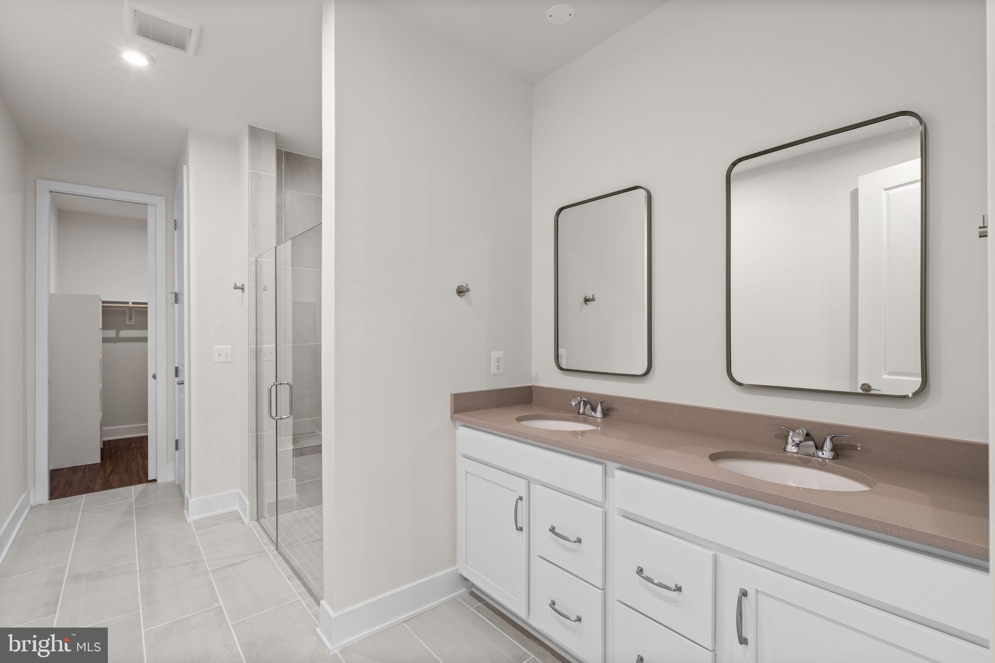 114 Keystone Winchester, VA 22603 - Photo 23 of 44 a bathroom with double vanity sinks and two mirror