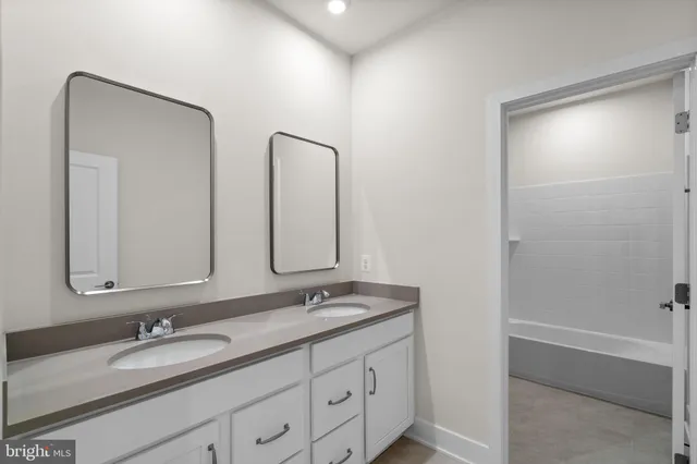 a bathroom with a bathtub and a toilet