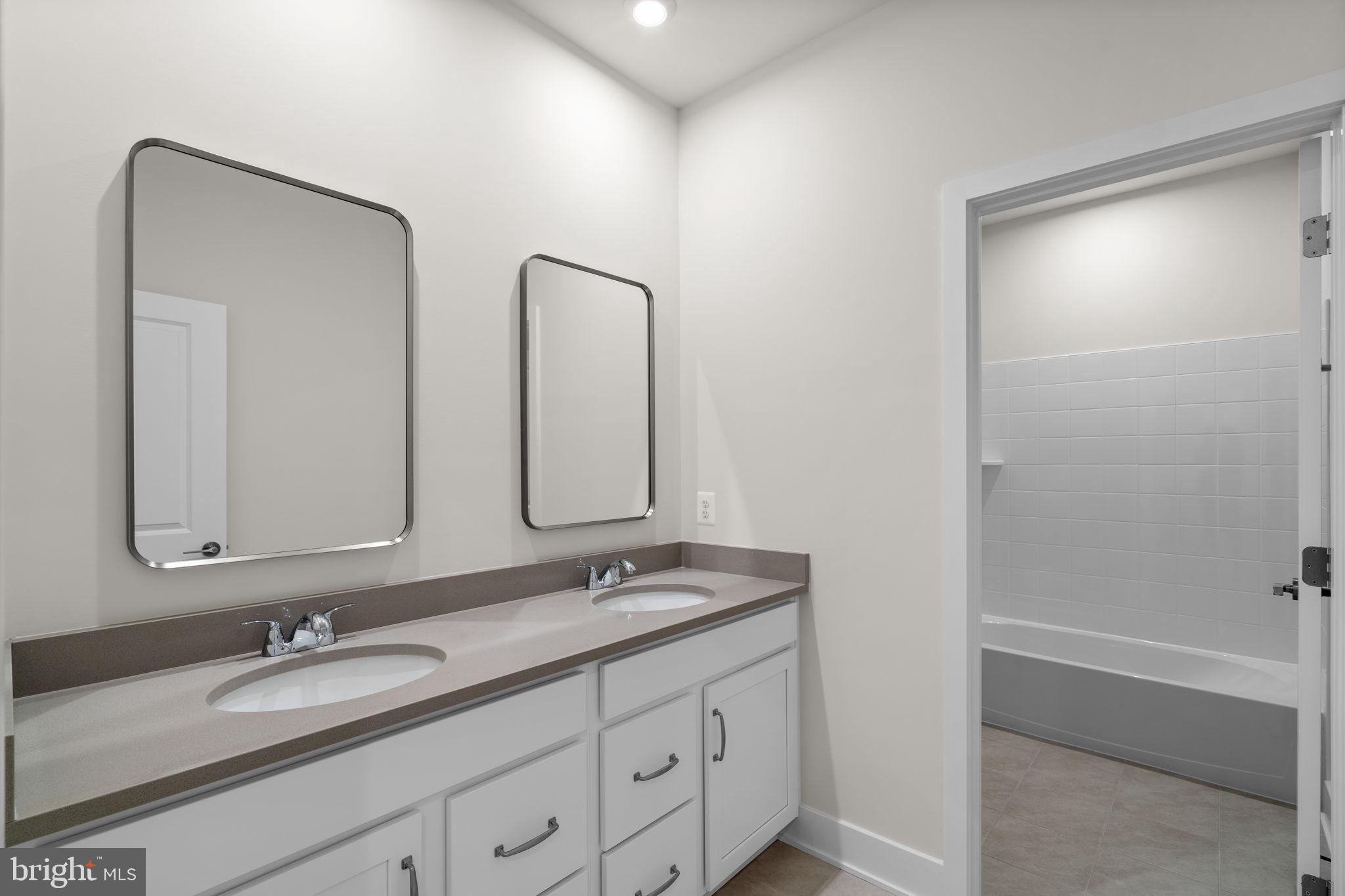 114 Keystone Winchester, VA 22603 - Photo 32 of 44 a bathroom with 2 sink and a mirror