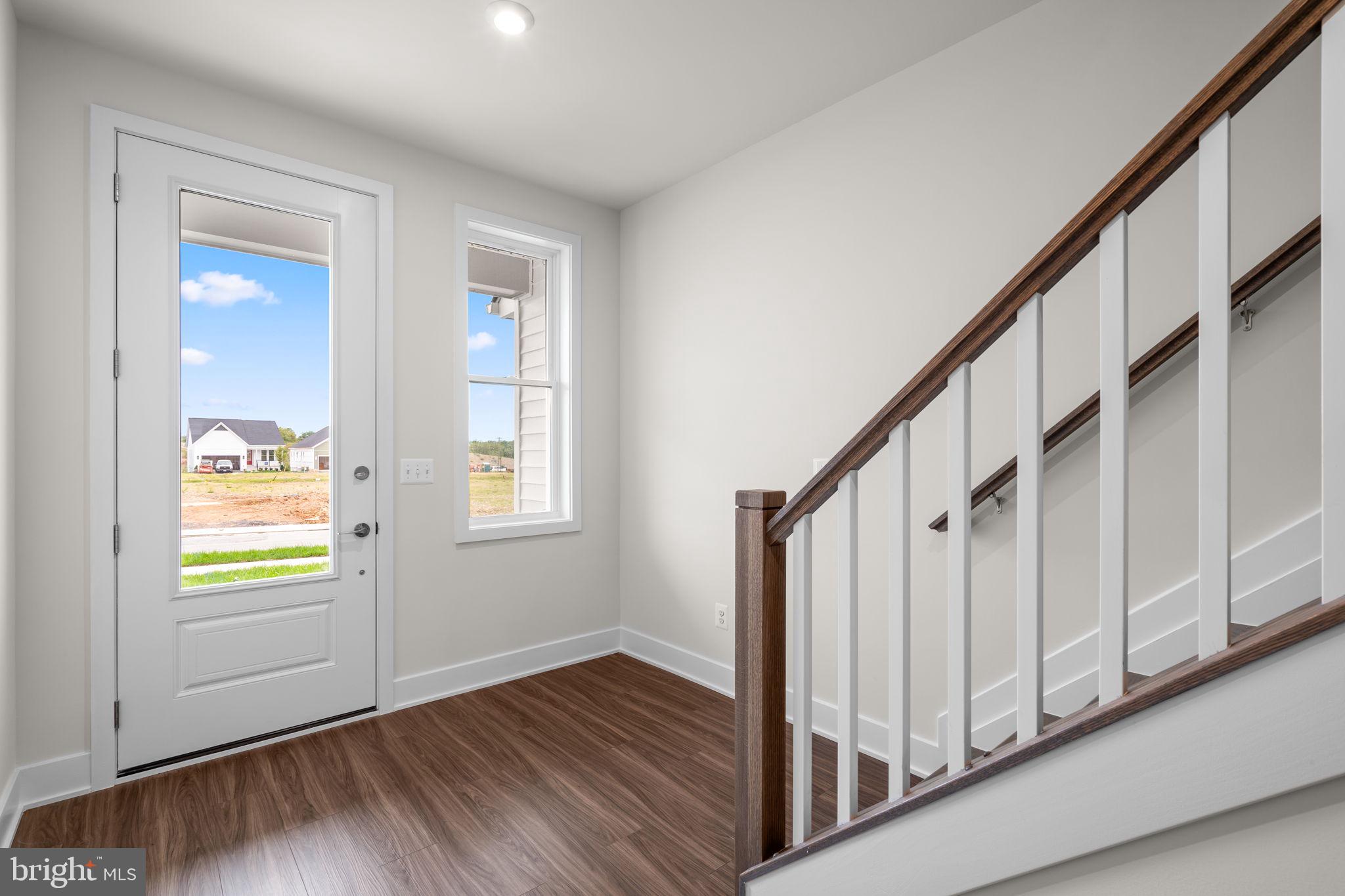 114 Keystone Winchester, VA 22603 - Photo 9 of 44 a view of an entryway with wooden floor and stairs