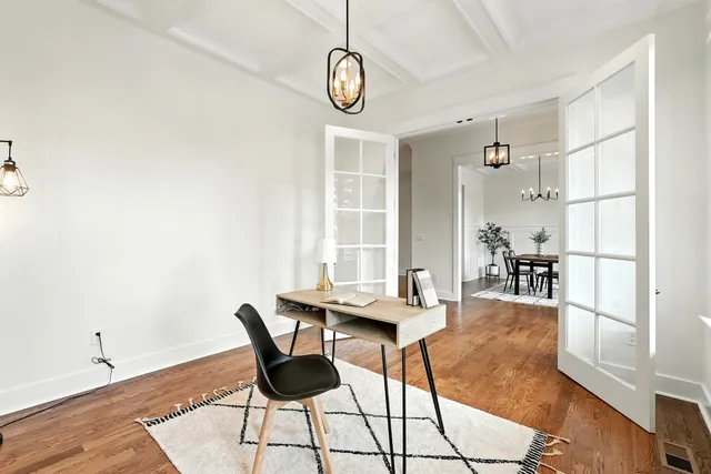 a kitchen with stainless steel appliances granite countertop a stove a sink a microwave a center island and furniture