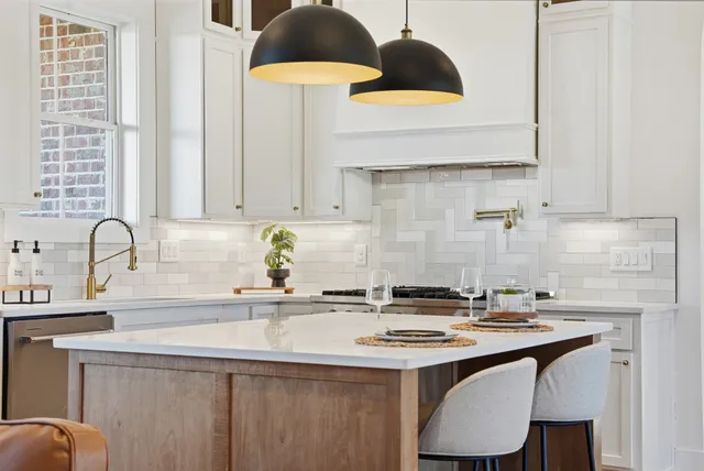 a kitchen with a stove and cabinets