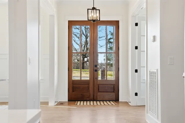 a view of a dining room with furniture and window