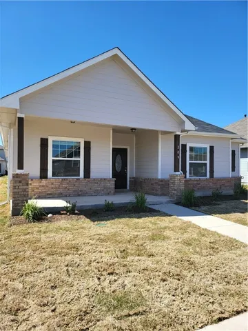 a front view of a house with swimming pool