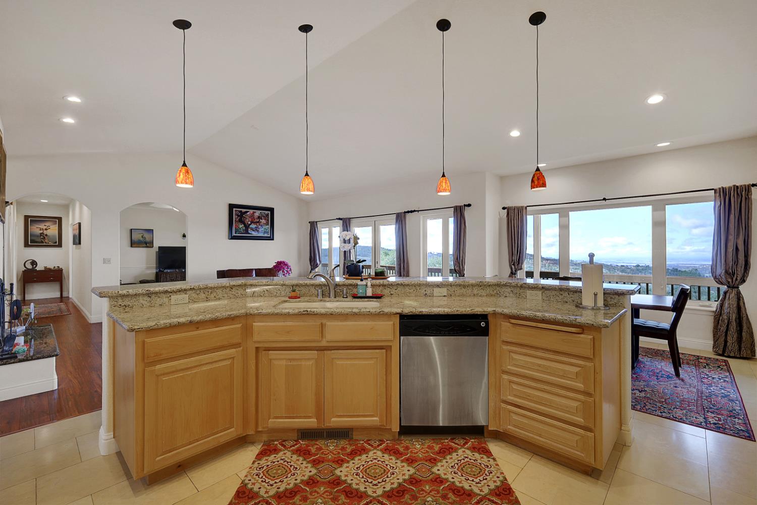 13680 Jessica Way Browns Valley, CA 95918 - Photo 18 of 73 a kitchen with kitchen island granite countertop a sink a counter space appliances and cabinets