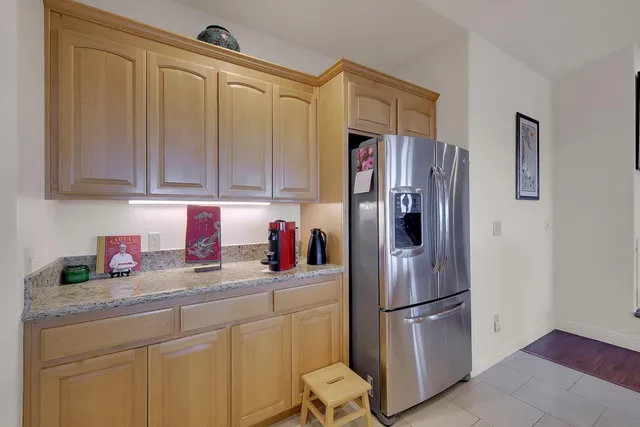a bedroom with a bed and flat screen tv
