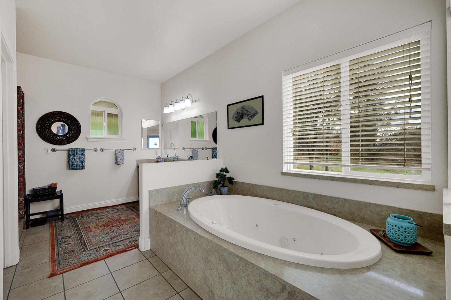 13680 Jessica Way Browns Valley, CA 95918 - Photo 39 of 74 a bathroom with a tub a sink and a window