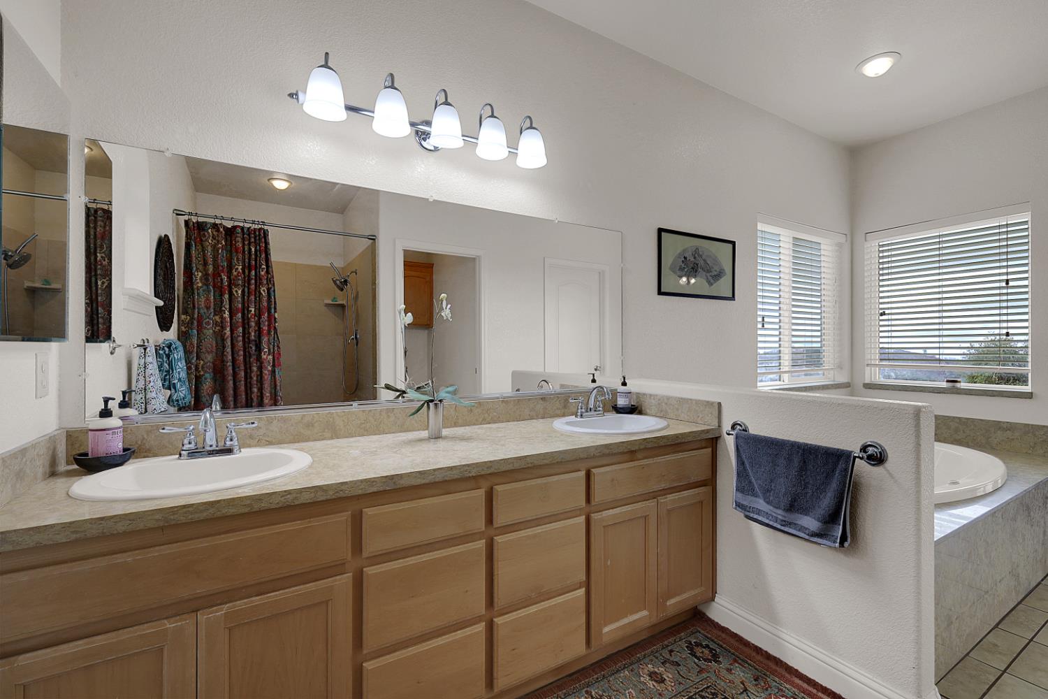 13680 Jessica Way Browns Valley, CA 95918 - Photo 41 of 74 a bathroom with a sink double vanity granite and a mirror