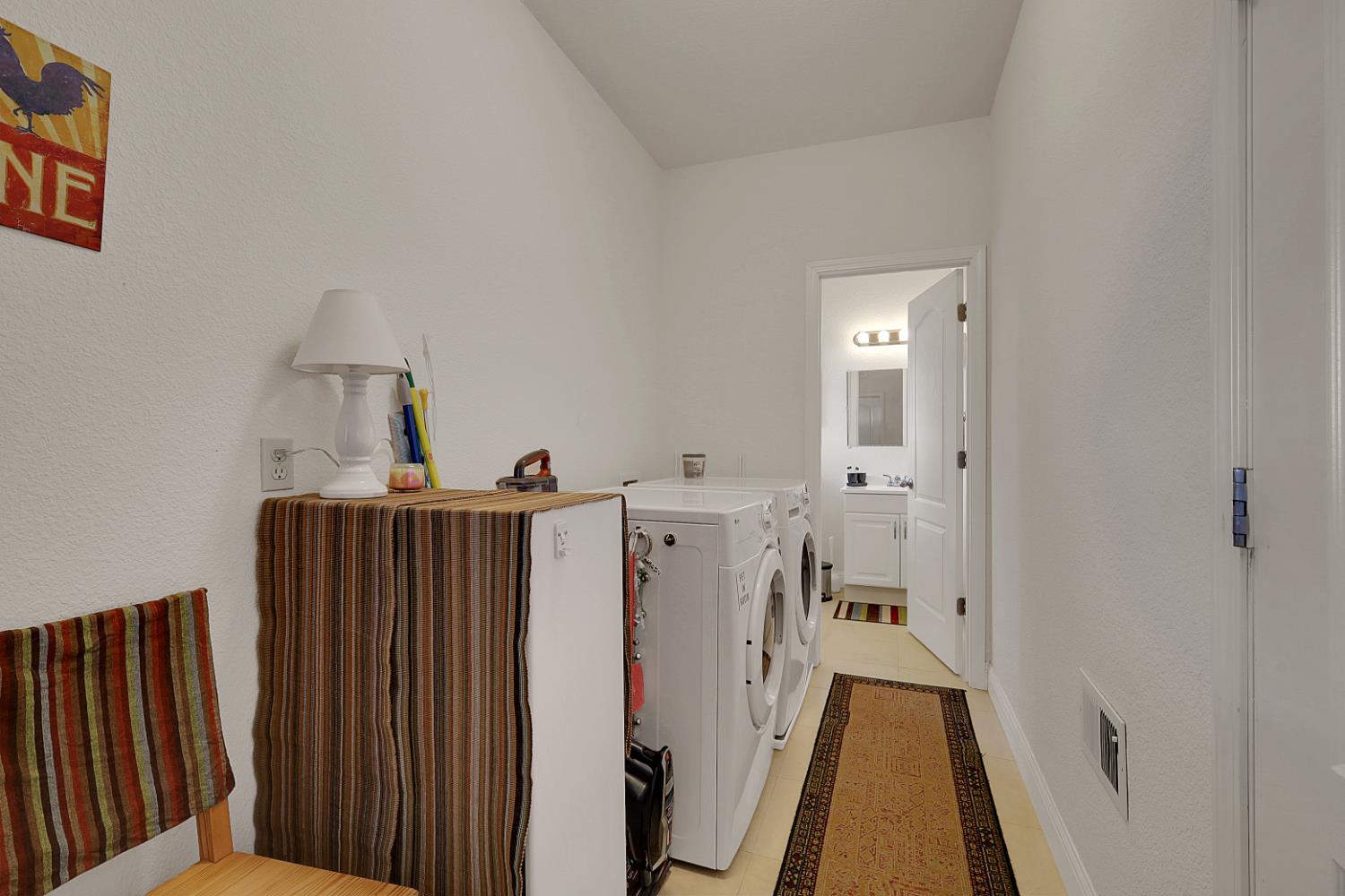 13680 Jessica Way Browns Valley, CA 95918 - Photo 43 of 74 Laundry room with half bath and door to decks and downstairs hallway access. Also, door to 4 car garage access.