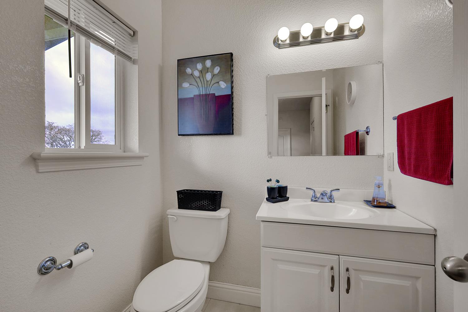 13680 Jessica Way Browns Valley, CA 95918 - Photo 43 of 73 a bathroom with a toilet a sink and mirror
