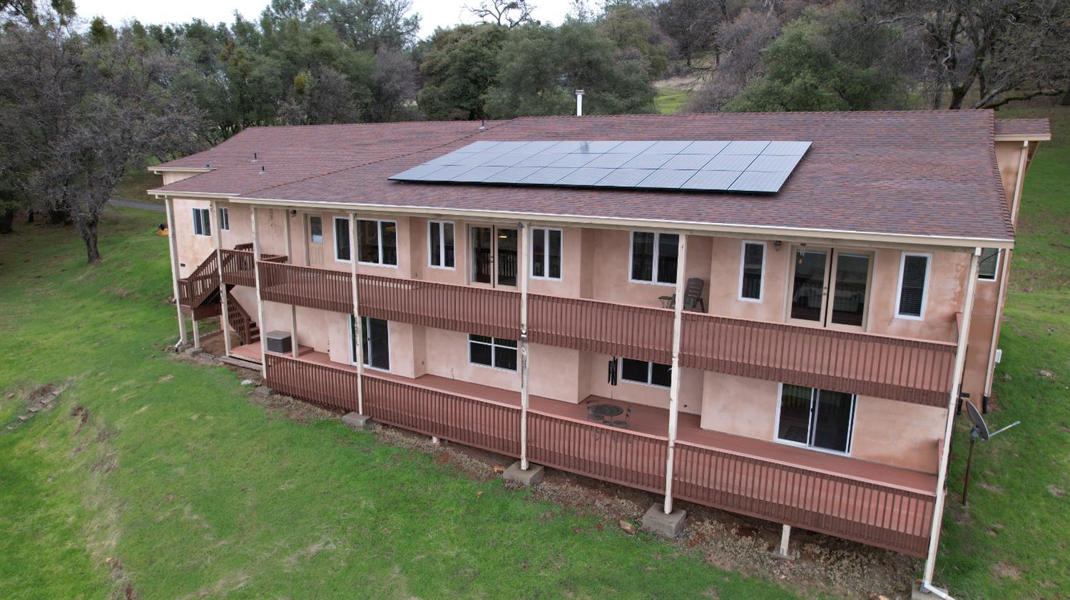 13680 Jessica Way Browns Valley, CA 95918 - Photo 5 of 73 Double decks with massive space and walls of windows and doors leading to decks. Paid for solar.