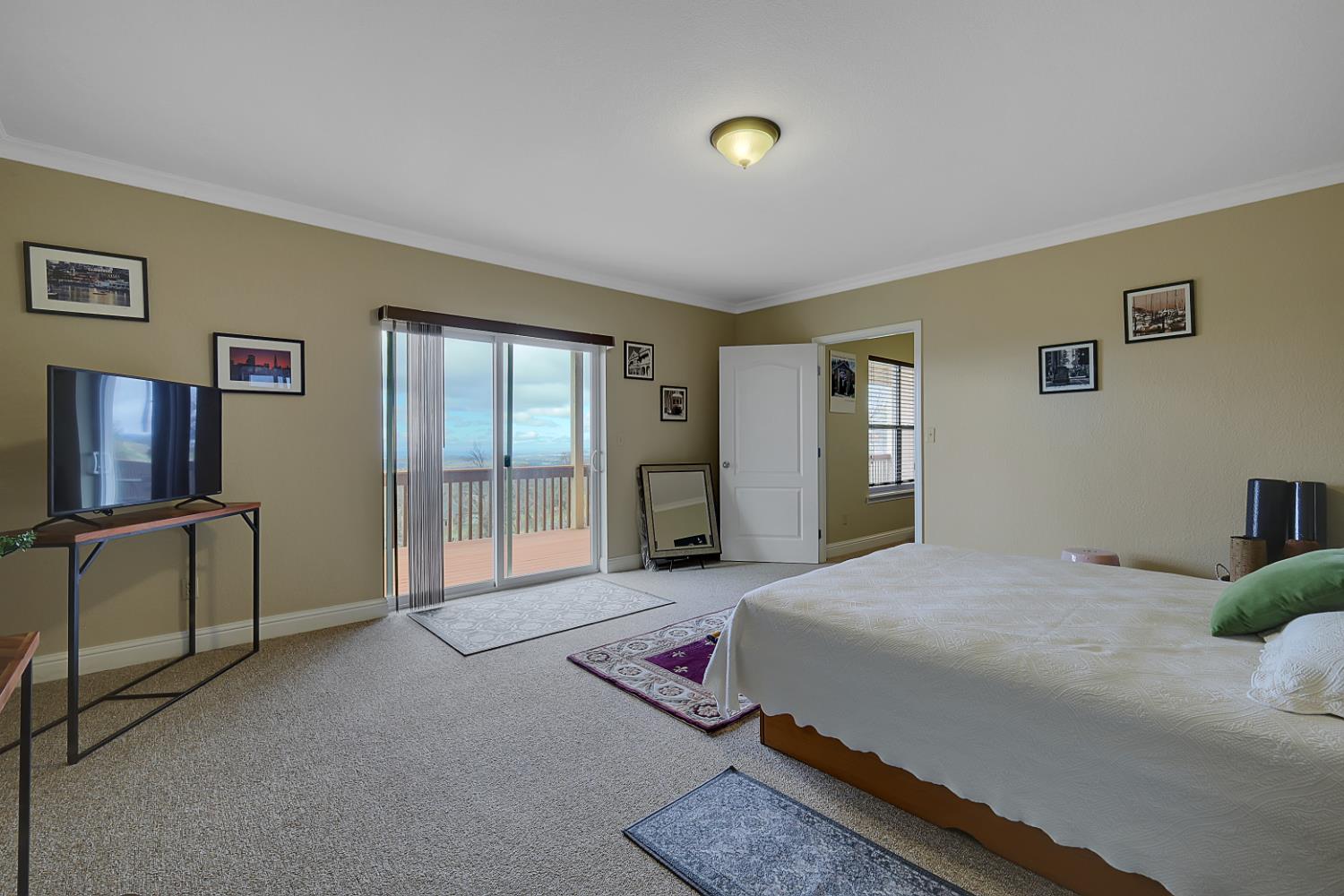 13680 Jessica Way Browns Valley, CA 95918 - Photo 54 of 74 a bedroom with a bed and large windows