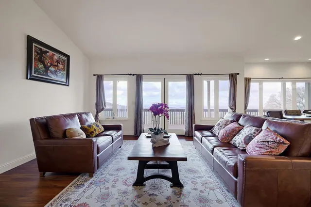 a kitchen with refrigerator and cabinets