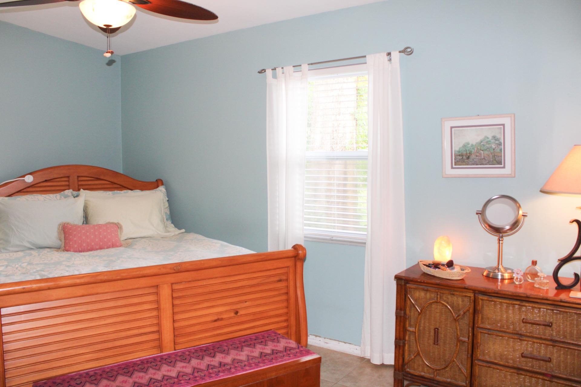 248 Spring Street St. Augustine, FL 32084 - Photo 21 of 50 a bedroom with a bed and a chandelier