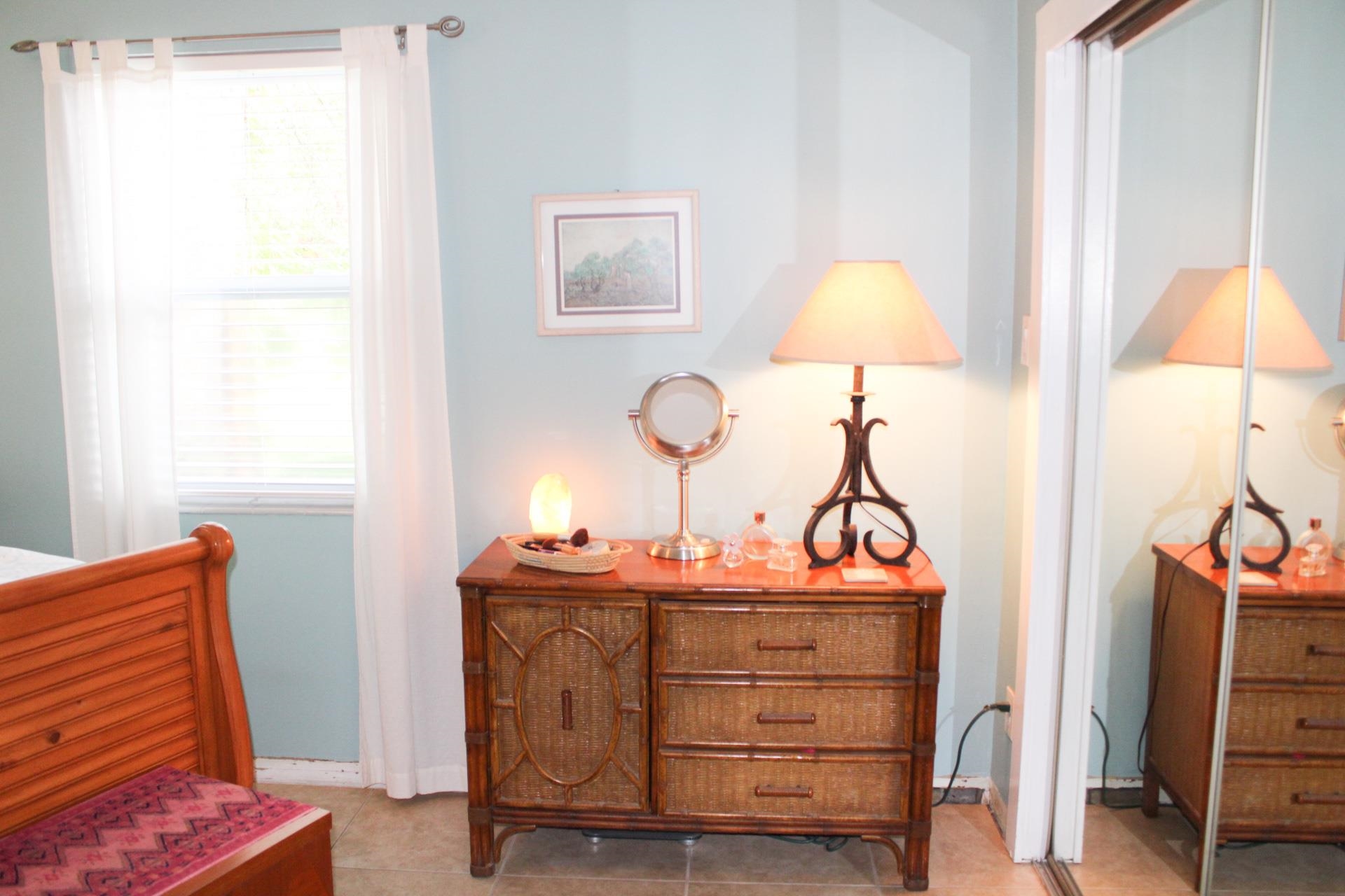248 Spring Street St. Augustine, FL 32084 - Photo 23 of 50 a bedroom with a bed and a lamp on the table