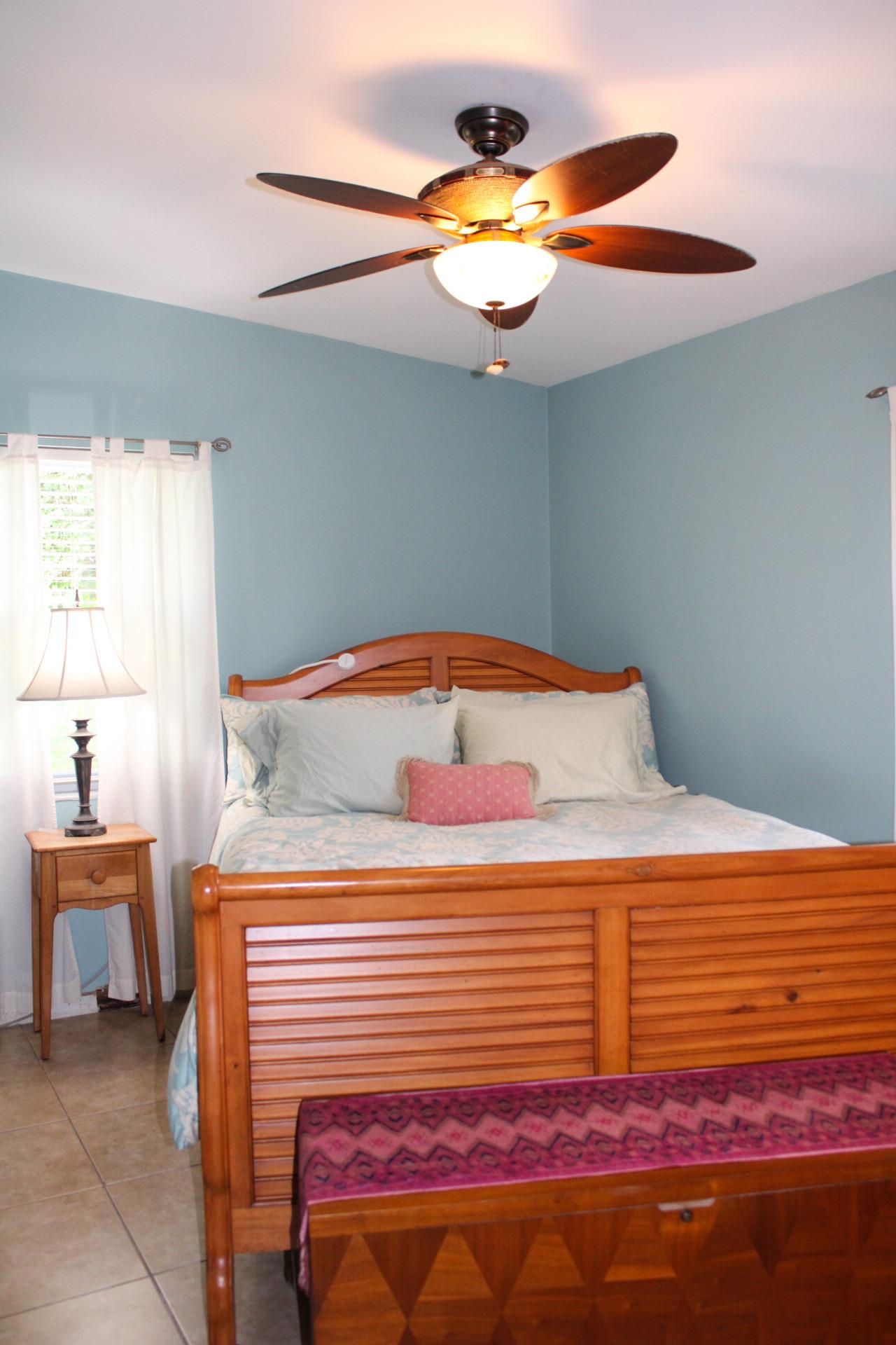 248 Spring Street St. Augustine, FL 32084 - Photo 24 of 50 a bedroom with a bed and a chandelier