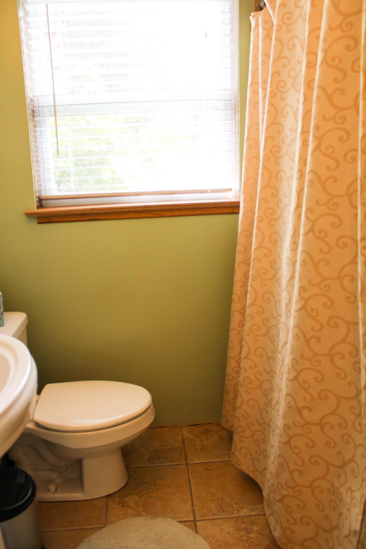 248 Spring Street St. Augustine, FL 32084 - Photo 26 of 50 a bathroom with a toilet and a shower