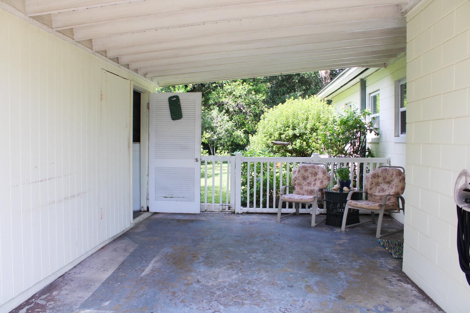 248 Spring Street St. Augustine, FL 32084 - Photo 30 of 50 a view of a chairs and bench in the backyard