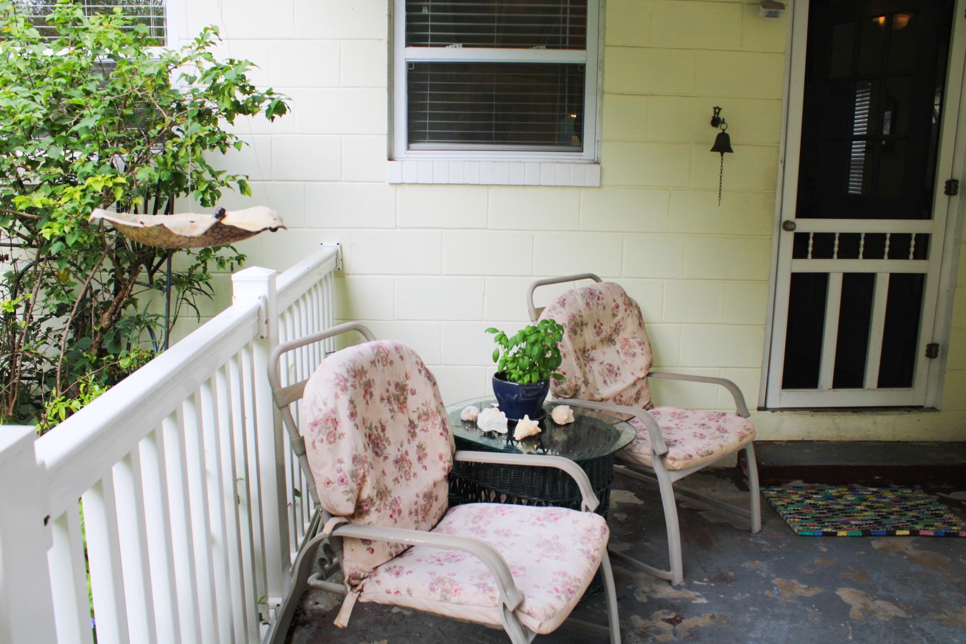 248 Spring Street St. Augustine, FL 32084 - Photo 5 of 50 a balcony with table and chairs