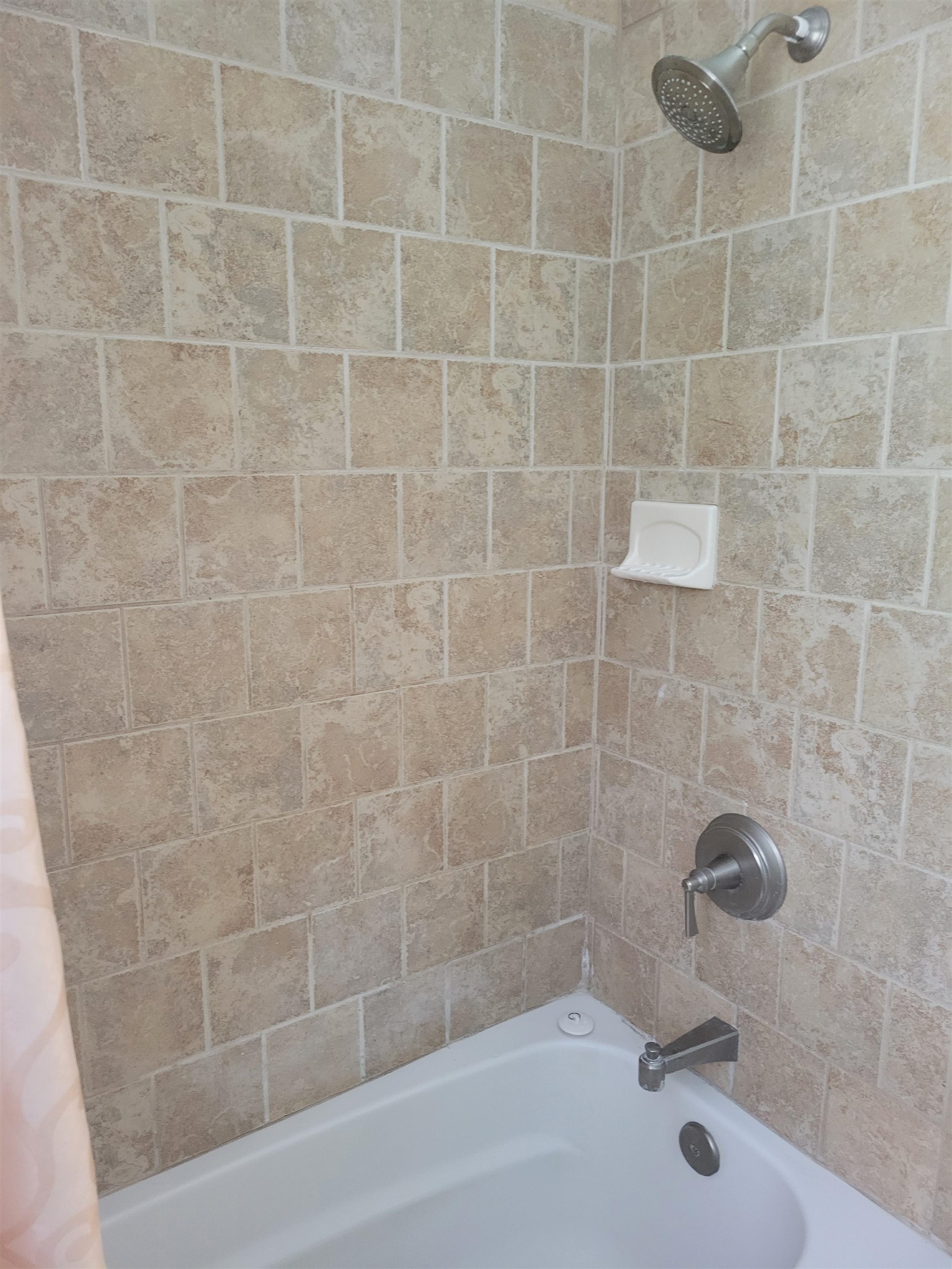 248 Spring Street St. Augustine, FL 32084 - Photo 50 of 50 a bathroom with a shower and a bathtub