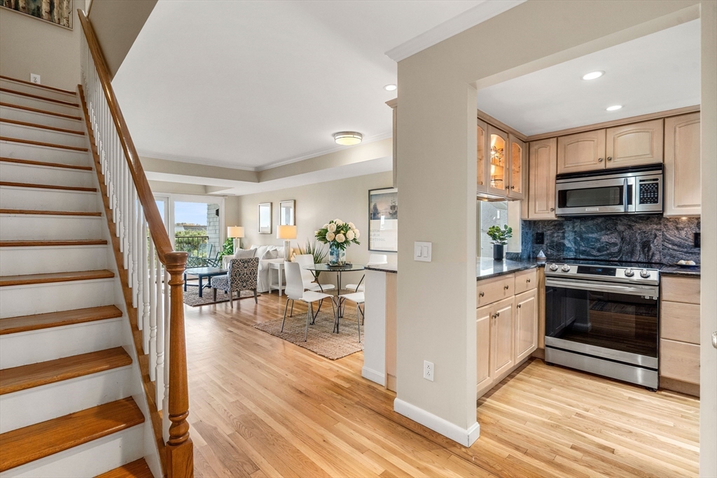 55 Brackett Place, Unit D Marblehead, MA 01945 - Photo 13 of 34 a view of a kitchen with furniture and wooden floor