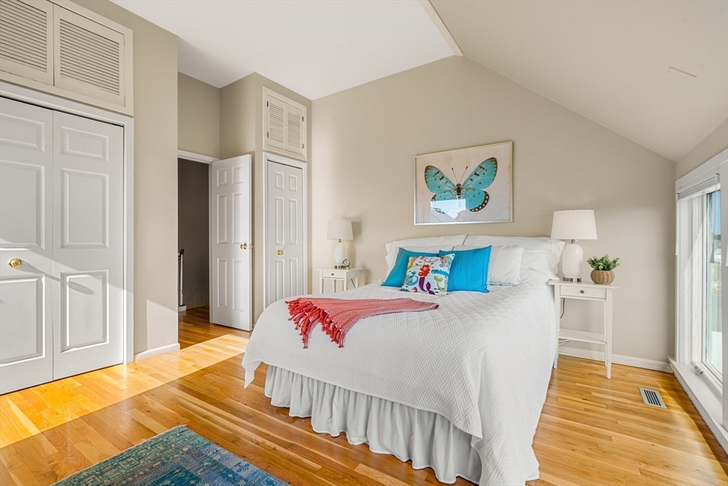 55 Brackett Place, Unit D Marblehead, MA 01945 - Photo 15 of 34 a bedroom with a bed and a view of kitchen