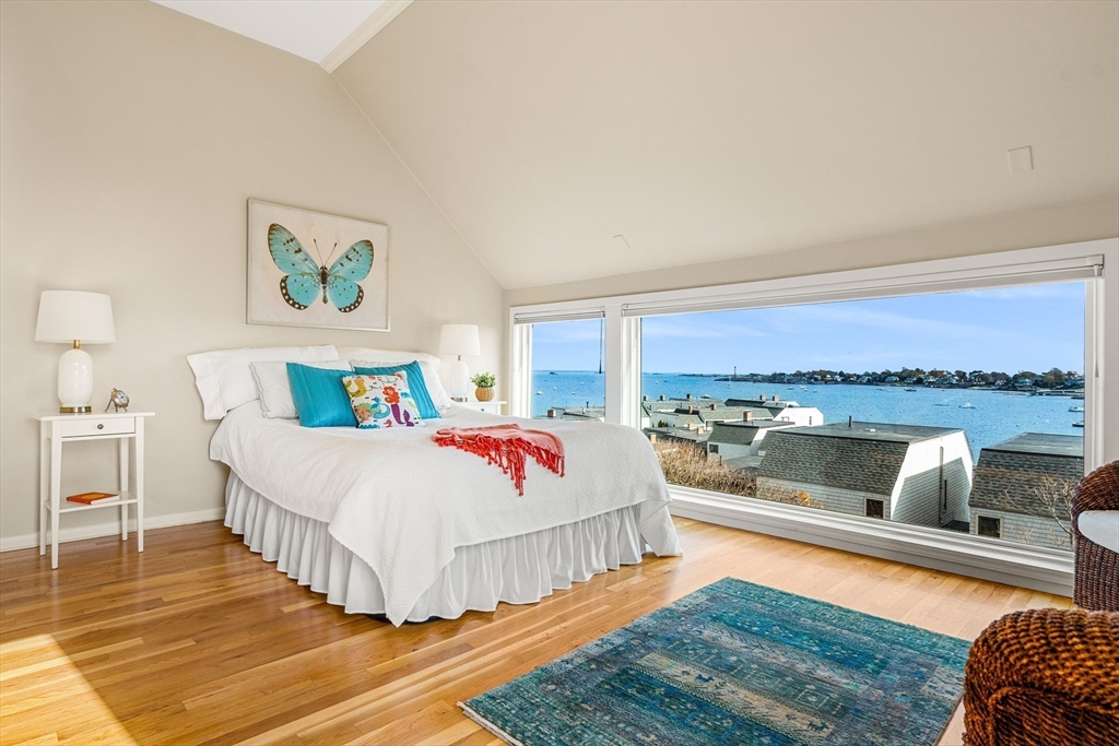 55 Brackett Place, Unit D Marblehead, MA 01945 - Photo 2 of 34 a bedroom with a bed and a view of balcony