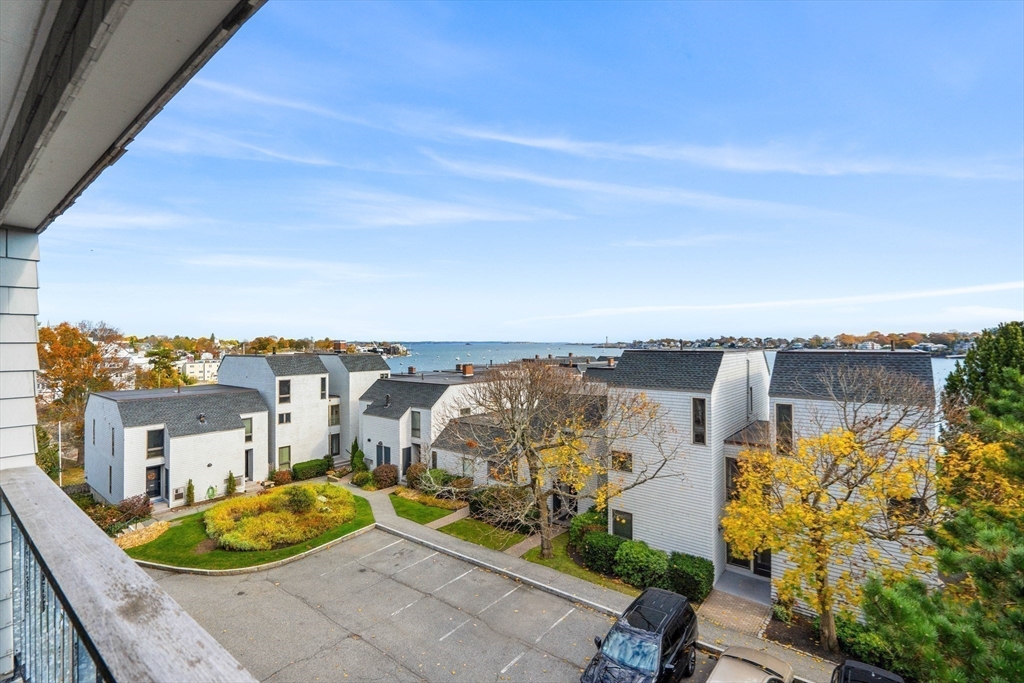 55 Brackett Place, Unit D Marblehead, MA 01945 - Photo 22 of 34 an aerial view of a house with a ocean view