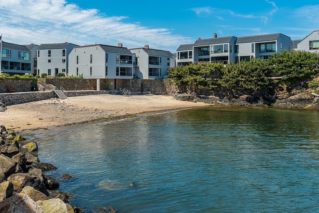 55 Brackett Place, Unit D Marblehead, MA 01945 - Photo 24 of 34 a front view of a house with a yard